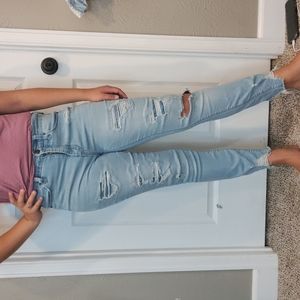 Distressed blue jeans with some patches